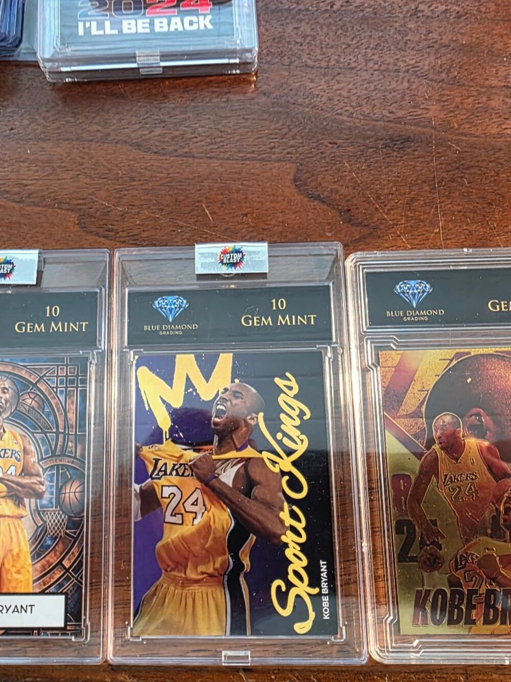 10 VARIOUS CARDS AND SLABBS AND 2PCS OF SLABBED COINS ALL OF KOBY BRYANT